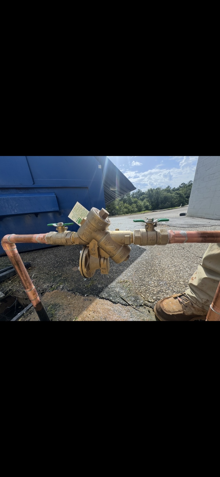 Commercial backflow preventer installation in progress