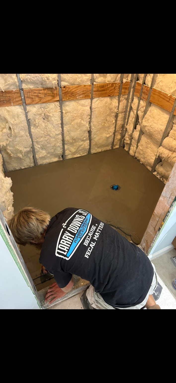 Larry Downs Jr. Plumbing completing the shower remodel construction and pan stage